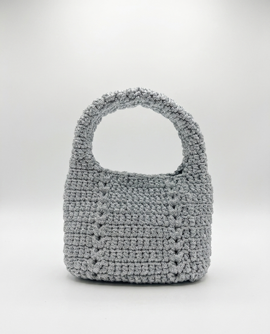 Gray crochet handbag on a white background